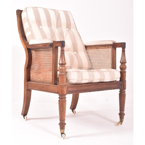 380 - A 19th century mahogany framed bergere library armchair in the manner of Gillows. The chair having a... 