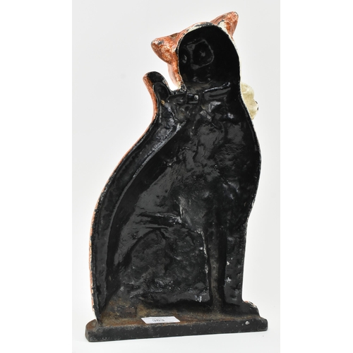 383 - A Victorian 19th century hand painted cast iron shaped door stop in the form of a cat. The cat paint... 