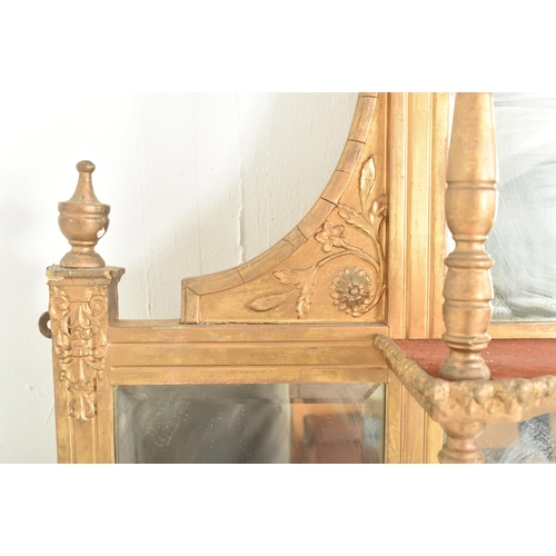 387 - An early 20th century gilt wood over mantel mirror shelf. The mantel mirror having a hood pediment a... 