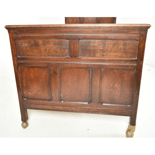 388 - A 17th century commonwealth revival oak single bed. The bed having matching head and footboard with ... 