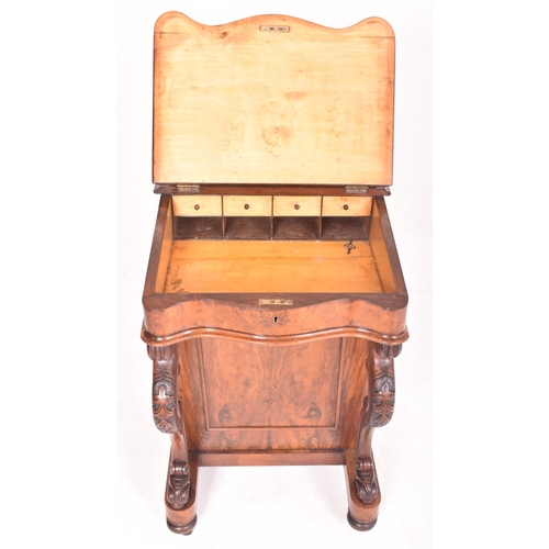 390 - A Victorian 19th century walnut davenport writing desk. The desk having a raised desk tidy space ato... 