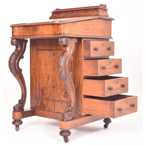 390 - A Victorian 19th century walnut davenport writing desk. The desk having a raised desk tidy space ato... 