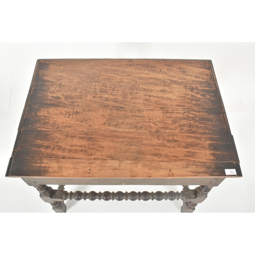 398 - A 17th century carved oak peg jointed occasional writing table. The table having a rectangular top w... 