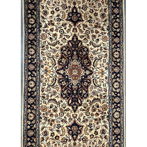 403 - A 20th century Afghan Persian floor carpet runner rug. The runner having a central medallion on blue... 