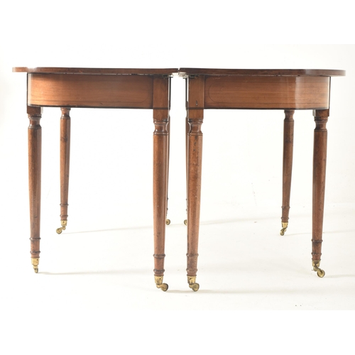 408 - A George III 19th century mahogany large D-end extending dining table with chairs. The table having ... 