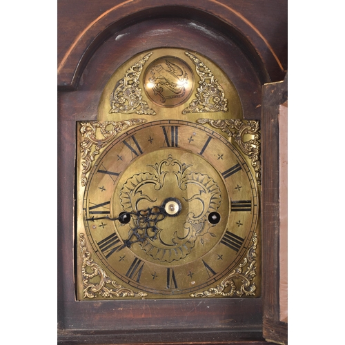 411 - A late 18th century mahogany and brass facedmdouble fusee longcase clock. The clock having scrolled ... 