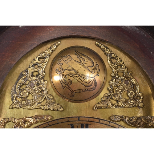 411 - A late 18th century mahogany and brass facedmdouble fusee longcase clock. The clock having scrolled ... 