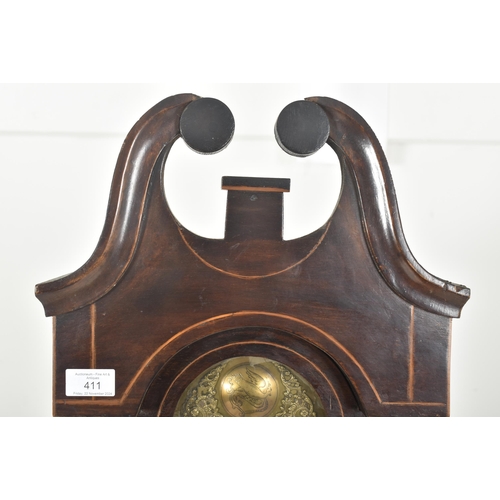 411 - A late 18th century mahogany and brass facedmdouble fusee longcase clock. The clock having scrolled ... 