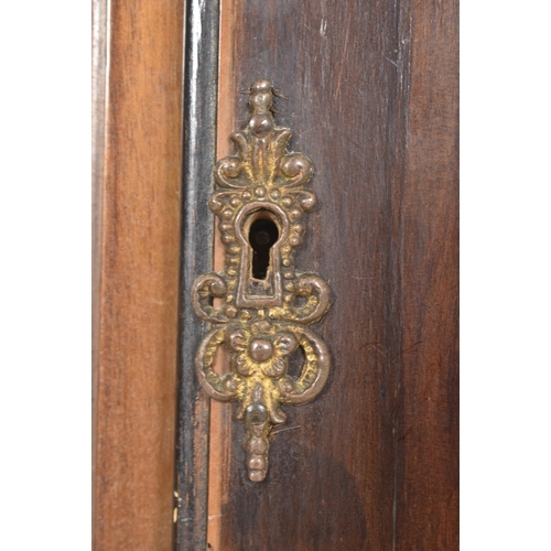 411 - A late 18th century mahogany and brass facedmdouble fusee longcase clock. The clock having scrolled ... 