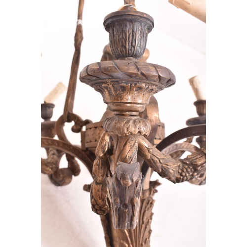 417 - A large Italian inspired Baroque style cast iron six arm chandelier ceiling light. The chandelier ha... 