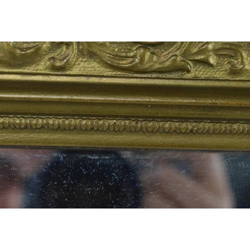 419 - A late 19th century giltwood cassetta wall hanging mirror. The mirror having carved foliate moulding... 