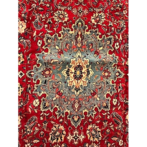 420 - A large 20th century North West Persian Sarouk floor carpet rug. The rug having a central light blue... 