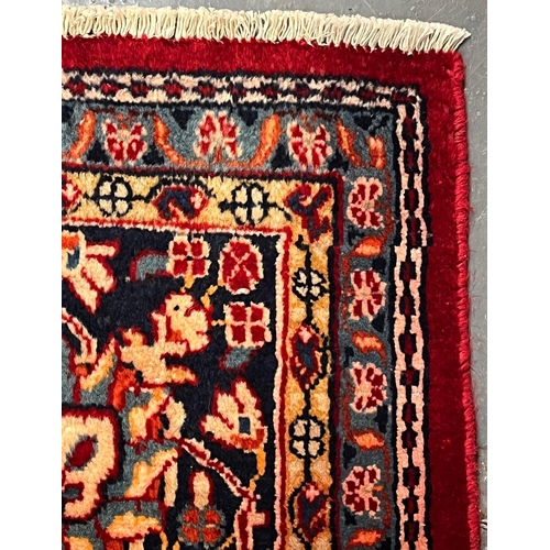 420 - A large 20th century North West Persian Sarouk floor carpet rug. The rug having a central light blue... 