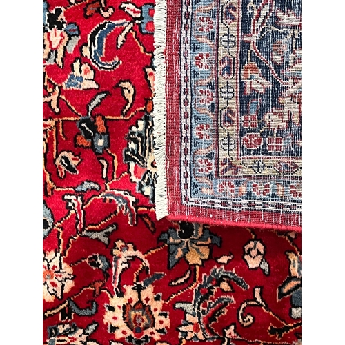 420 - A large 20th century North West Persian Sarouk floor carpet rug. The rug having a central light blue... 