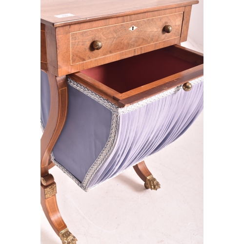 422 - A George III early 19th century mahogany & brass embellished ladies work / sewing table. The tab... 