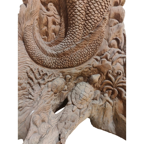 428 - A Polynesian inspired bespoke hand made carved tree trunk decorative sculpture. The tree trunk decor... 