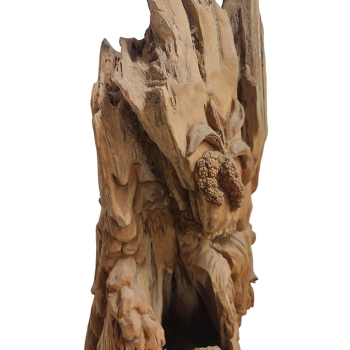 428 - A Polynesian inspired bespoke hand made carved tree trunk decorative sculpture. The tree trunk decor... 