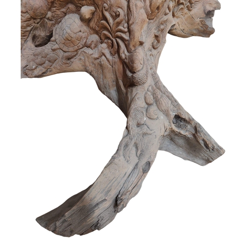 428 - A Polynesian inspired bespoke hand made carved tree trunk decorative sculpture. The tree trunk decor... 