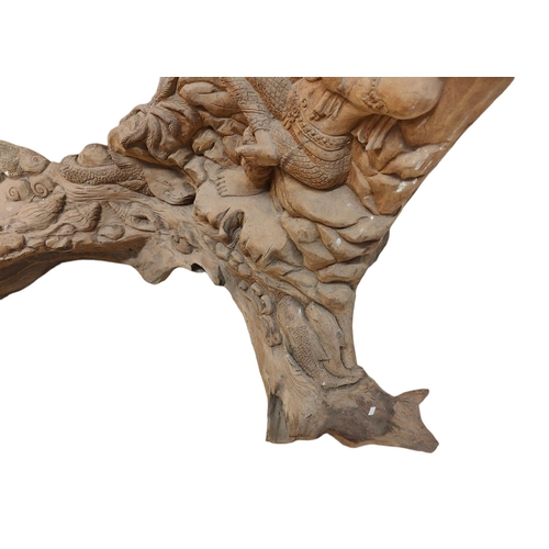 428 - A Polynesian inspired bespoke hand made carved tree trunk decorative sculpture. The tree trunk decor... 