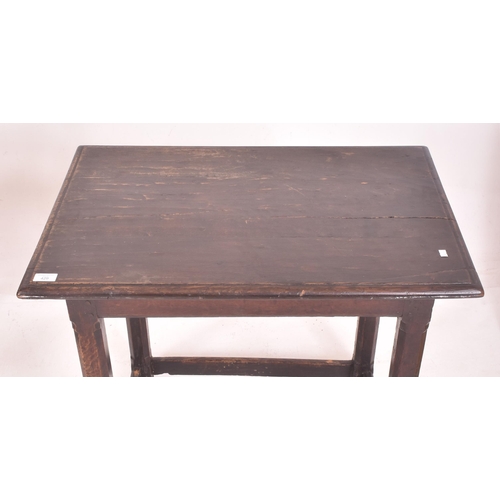 429 - An 18th century carved oak peg jointed side occasional lowboy table. The table having a rectangular ... 