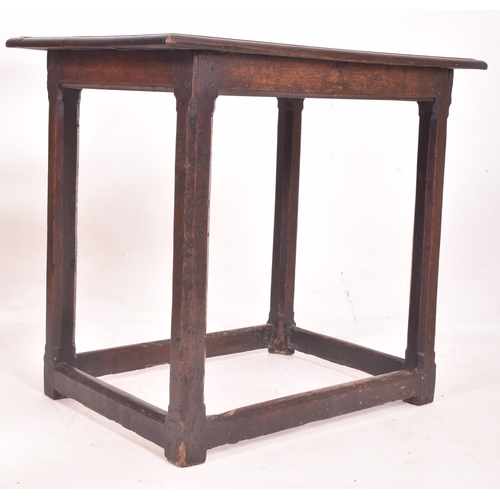 429 - An 18th century carved oak peg jointed side occasional lowboy table. The table having a rectangular ... 