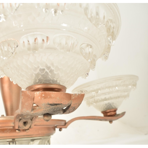 432 - A 20th century Art Deco style ceiling pendant chandelier with five frosted shades. The light featuri... 