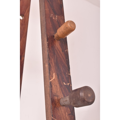 434 - A large early 20th century oak artist's folding easel with adjustable pegs. The easel having four sq... 