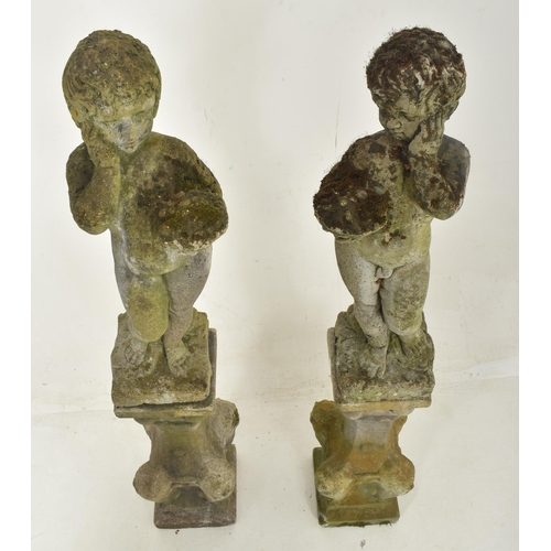 436 - A pair of early 20th century reconstituted stone garden outdoor decorative pedestal cherubs on stand... 