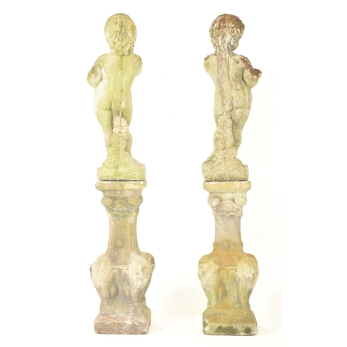 436 - A pair of early 20th century reconstituted stone garden outdoor decorative pedestal cherubs on stand... 