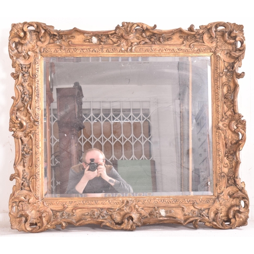 441 - A 19th century Florentine gilt wood & gesso overmantel mirror. The mirror having a intricately c... 