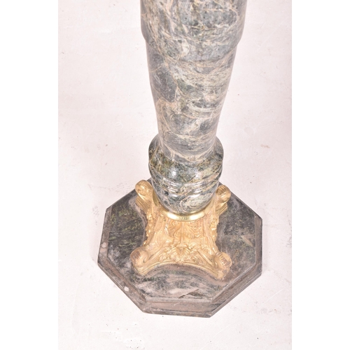 443 - An Italian inspired green marble and gilded metal turned column stand. The column having an octagona... 