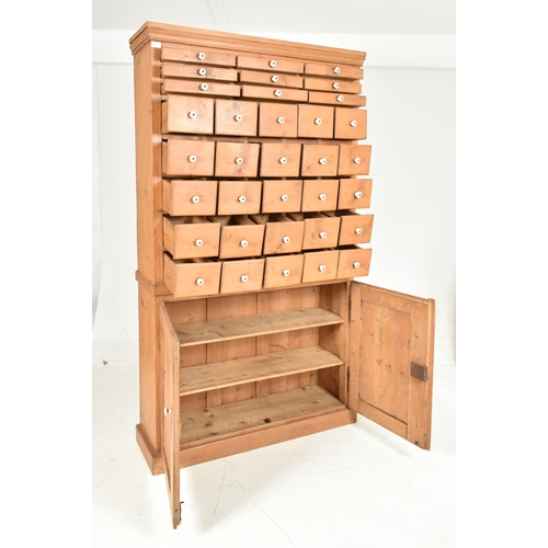 445 - A 19th century large shop haberdashery pine cabinet cupboard with multi chest of drawers. The haberd... 