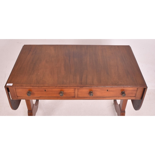 448 - A Regency early 19th century mahogany inlaid drop leaf writing table desk / sofa table. The table ha... 