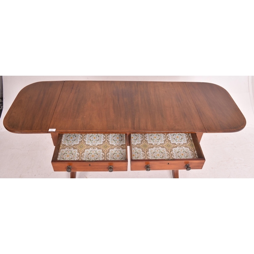 448 - A Regency early 19th century mahogany inlaid drop leaf writing table desk / sofa table. The table ha... 