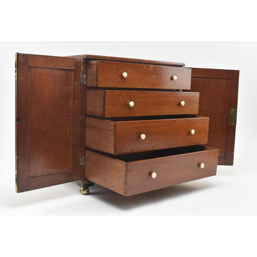 454 - A 19th century Victorian mahogany specimen table top chest / cabinet. The chest having two blind fro... 