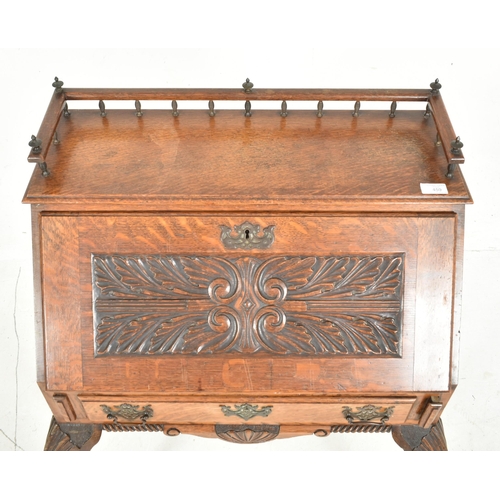 459 - Manner of Pugin - An Edwardian early 20th century carved oak bureau writing desk. The bureau with ra... 