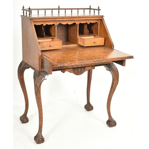 459 - Manner of Pugin - An Edwardian early 20th century carved oak bureau writing desk. The bureau with ra... 