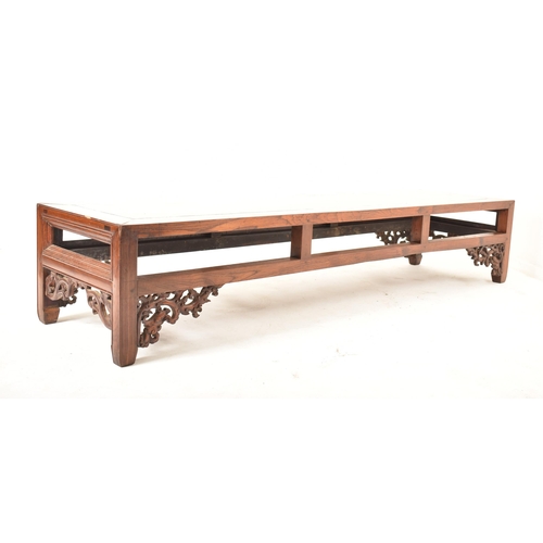 466 - A large Oriental Chinese influenced carved hardwood low occasional coffee -side table. The table hav... 