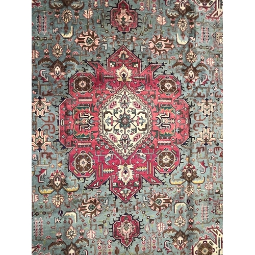 468 - A large early 20th century North West Persian Islamic Tabriz floor carpet rug. The rug having a styl... 