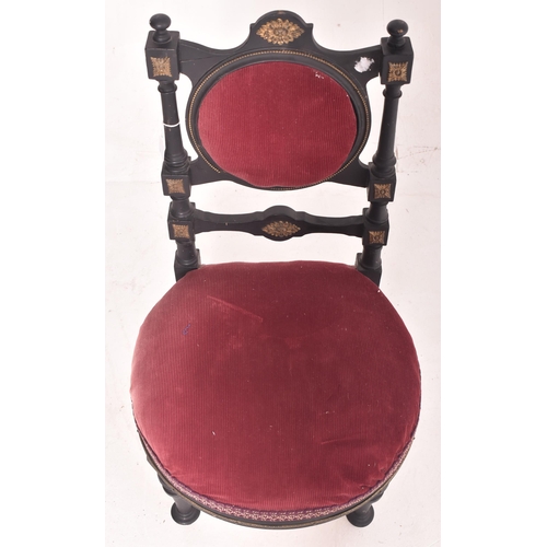 473 - An Arts & Crafts early 20th century ebonised wood & velvet upholstered low nursing chair. Th... 