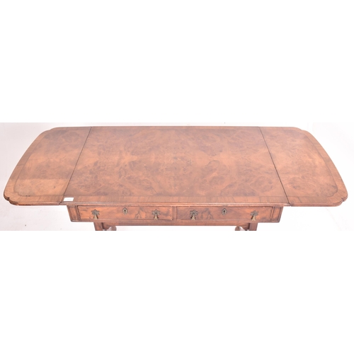 474 - A Regency early 19th century walnut drop leaf sofa writing table desk. The table having a rectangula... 