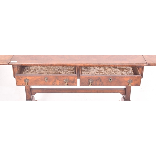 474 - A Regency early 19th century walnut drop leaf sofa writing table desk. The table having a rectangula... 