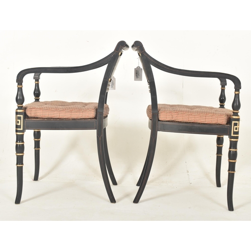 480 - A pair of Regency style ebonised & gilt painted wood rattan woven open back armchairs with Neocl... 