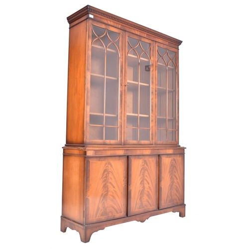 481 - A large George III Revival flame mahogany triple section three door astragal glazed bookcase library... 