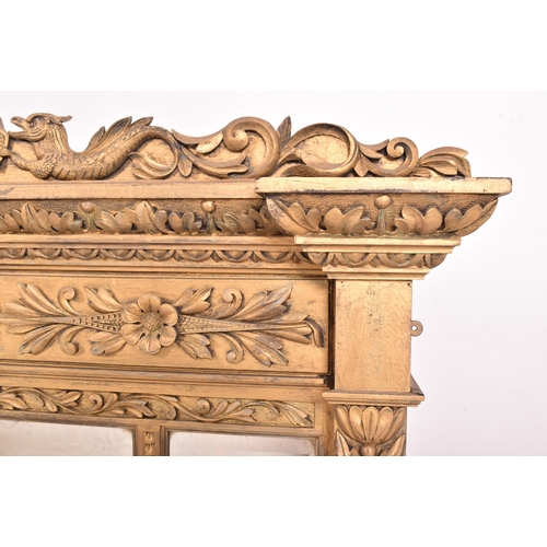 482 - A Regency Revival giltwood triptych overmantel wall mirror. The mirror having a pediment atop with p... 