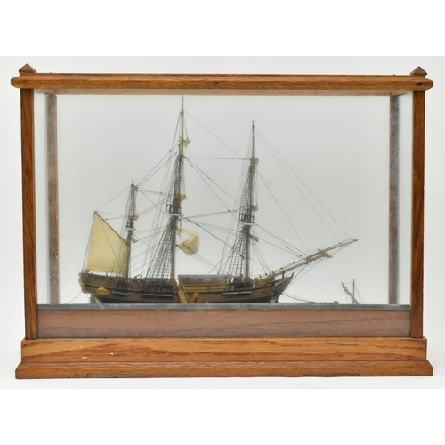 485 - A 20th century hand-built model boat diorama in oak & glass case. The diorama depicting a vessel... 