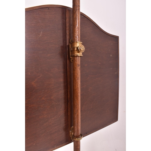 493 - A Victorian 19th century mahogany & needlepoint fire pole screen. The screen having a shaped mah... 