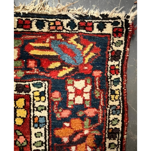 494 - An early 20th centuy Persian Islamic Bakhtiari hand woven floor carpet rug. The rug having a polychr... 