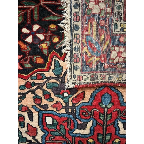 494 - An early 20th centuy Persian Islamic Bakhtiari hand woven floor carpet rug. The rug having a polychr... 