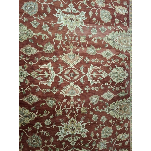 495 - An early 20th century Persian Islamic Sarouk Mer floor carpet rug. The rug having a central red grou... 